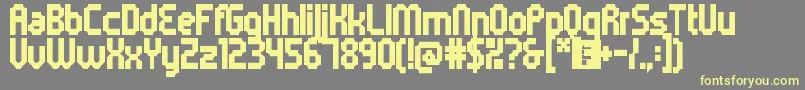 フォント5metrikBlackCondensed – 黄色のフォント、灰色の背景