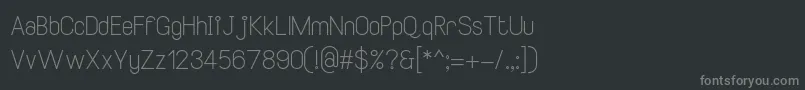 Fonte SmileySansRegular – fontes cinzas em um fundo preto