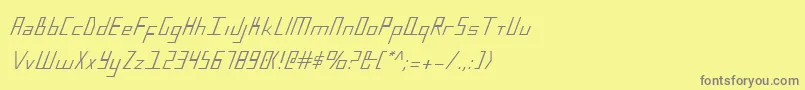 BlueJulyCondensed-fontti – harmaat kirjasimet keltaisella taustalla