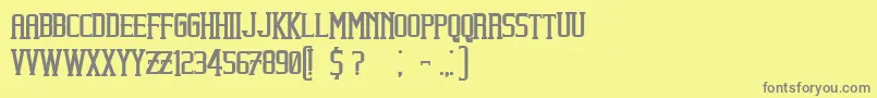 フォントBeholderBold – 黄色の背景に灰色の文字