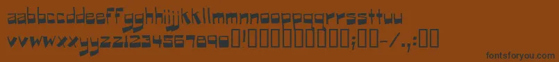 フォントPuckfont – 黒い文字が茶色の背景にあります