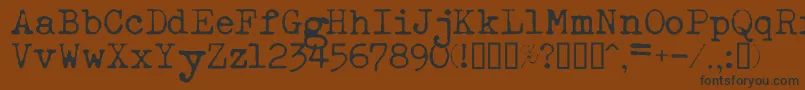 フォントEsathnrml – 黒い文字が茶色の背景にあります