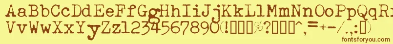 フォントEsathnrml – 茶色の文字が黄色の背景にあります。