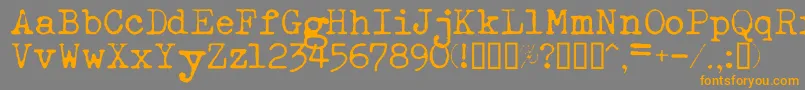 フォントEsathnrml – オレンジの文字は灰色の背景にあります。