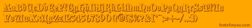 Blackwoodcastleshadow-Schriftart – Braune Schriften auf orangefarbenem Hintergrund