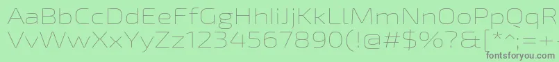 Exo2Thinexpanded-fontti – harmaat kirjasimet vihreällä taustalla
