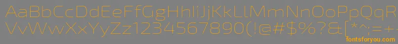 フォントExo2Thinexpanded – オレンジの文字は灰色の背景にあります。