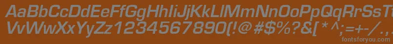 PalindromeSsiSemiBoldItalic-fontti – harmaat kirjasimet ruskealla taustalla