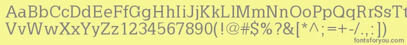 フォントLatinia – 黄色の背景に灰色の文字