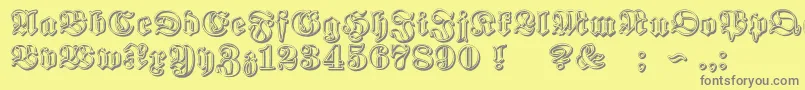 Fonte ProclamateRibbonHeavy – fontes cinzas em um fundo amarelo
