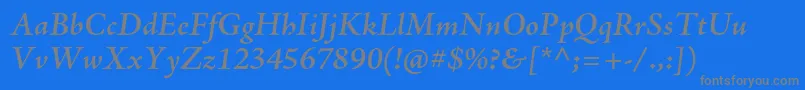 AjensonproSemiboldit-fontti – harmaat kirjasimet sinisellä taustalla