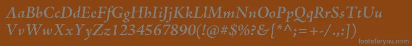 AjensonproSemiboldit-fontti – harmaat kirjasimet ruskealla taustalla