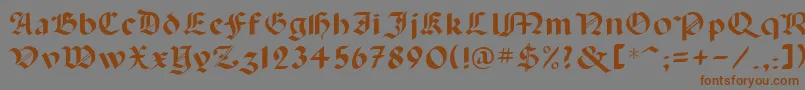 フォントLancas – 茶色の文字が灰色の背景にあります。