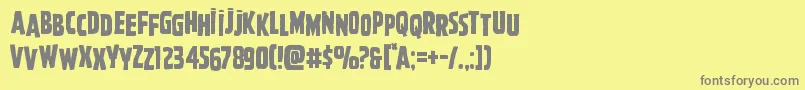 フォントGhoulishintentshift – 黄色の背景に灰色の文字