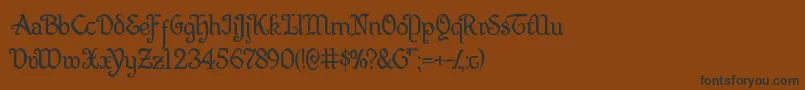 Quillsword Font – Black Fonts on Brown Background