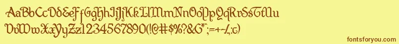 フォントQuillsword – 茶色の文字が黄色の背景にあります。