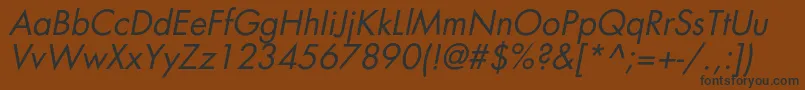 フォントAgfatumcItalic – 黒い文字が茶色の背景にあります