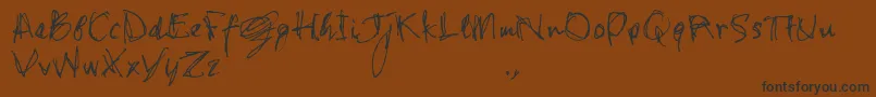 Czcionka Shstrial – czarne czcionki na brązowym tle