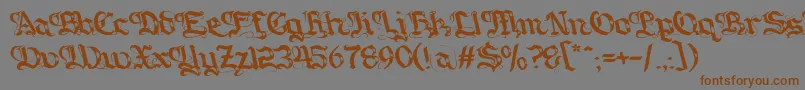 フォントGotique – 茶色の文字が灰色の背景にあります。