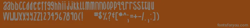 Fonte DjbLemonHeadBold – fontes cinzas em um fundo marrom