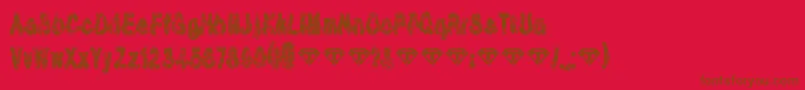 TioemBlackDistressed-fontti – ruskeat fontit punaisella taustalla