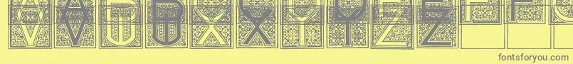 MosaicI-Schriftart – Graue Schriften auf gelbem Hintergrund