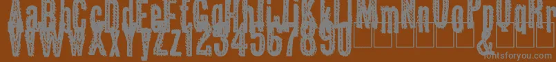 Okas Font – Gray Fonts on Brown Background