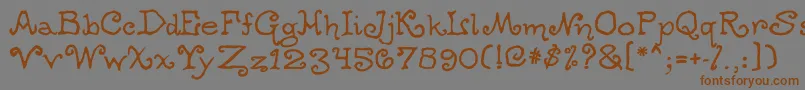 フォントOgdredweary – 茶色の文字が灰色の背景にあります。