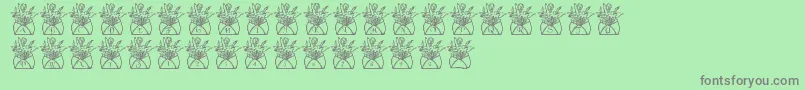 Fonte LmsLetterToMomPart1 – fontes cinzas em um fundo verde