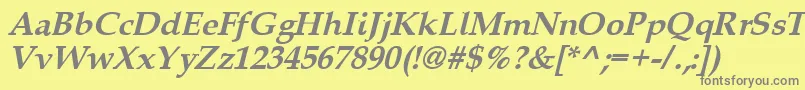 Queensbi-fontti – harmaat kirjasimet keltaisella taustalla