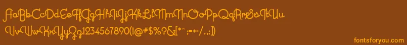 フォントNewRecord – オレンジ色の文字が茶色の背景にあります。