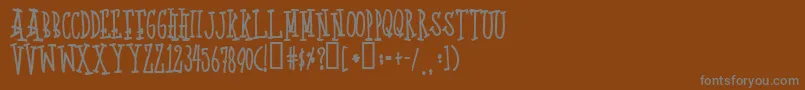 フォントQuotp – 茶色の背景に灰色の文字