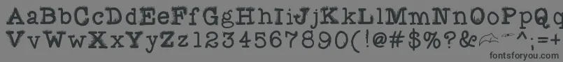 フォントFuzzybat – 黒い文字の灰色の背景