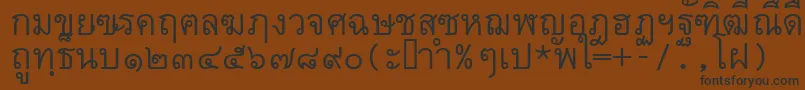 フォントThai7bangkokssk – 黒い文字が茶色の背景にあります