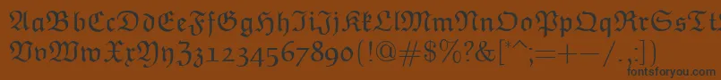 フォントEuclidFraktur – 黒い文字が茶色の背景にあります