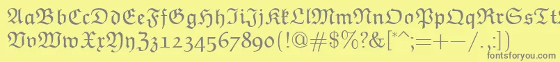 EuclidFraktur-fontti – harmaat kirjasimet keltaisella taustalla