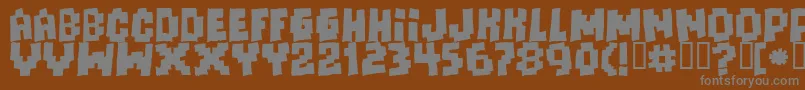 Шрифт Freaksofnaturemassive – серые шрифты на коричневом фоне