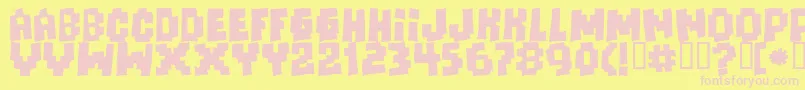 Freaksofnaturemassive-fontti – vaaleanpunaiset fontit keltaisella taustalla