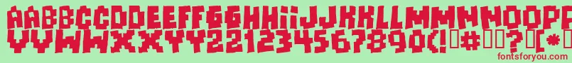 Freaksofnaturemassive-fontti – punaiset fontit vihreällä taustalla