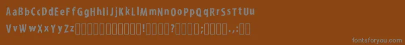 KroyfontRegular-Schriftart – Graue Schriften auf braunem Hintergrund