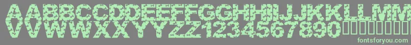 LmsCutItOut-Schriftart – Grüne Schriften auf grauem Hintergrund
