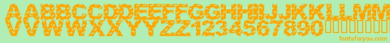 フォントLmsCutItOut – オレンジの文字が緑の背景にあります。