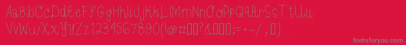 フォントBloom – 赤い背景に灰色の文字