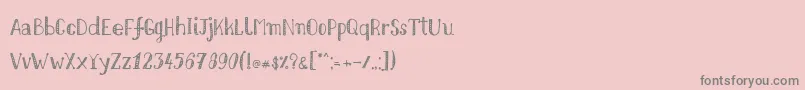フォントNikolaidishand – ピンクの背景に灰色の文字
