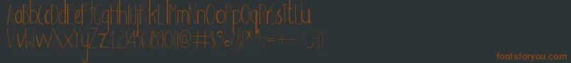 Шрифт Adouliss – коричневые шрифты на чёрном фоне