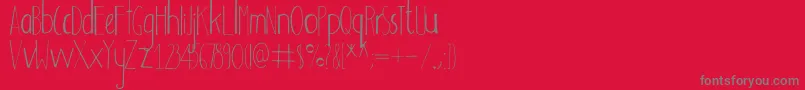 フォントAdouliss – 赤い背景に灰色の文字