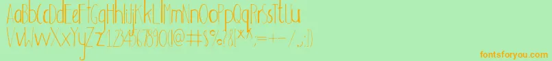 Adouliss Font – Orange Fonts on Green Background