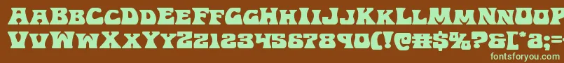 フォントHippocketexpand – 緑色の文字が茶色の背景にあります。
