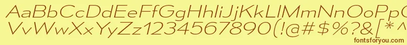 MesmerizeExElIt Font – Brown Fonts on Yellow Background