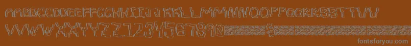 Pixeldraw-fontti – harmaat kirjasimet ruskealla taustalla